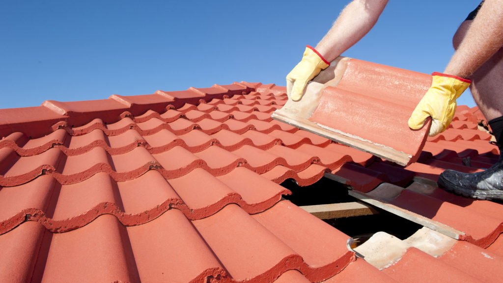 Person-Installing-Roof-Tiles