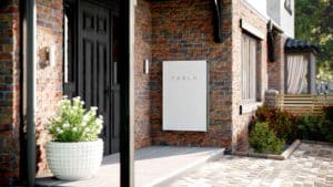 White-Tesla-Powerwall-On-The-Wall-Of-The-House